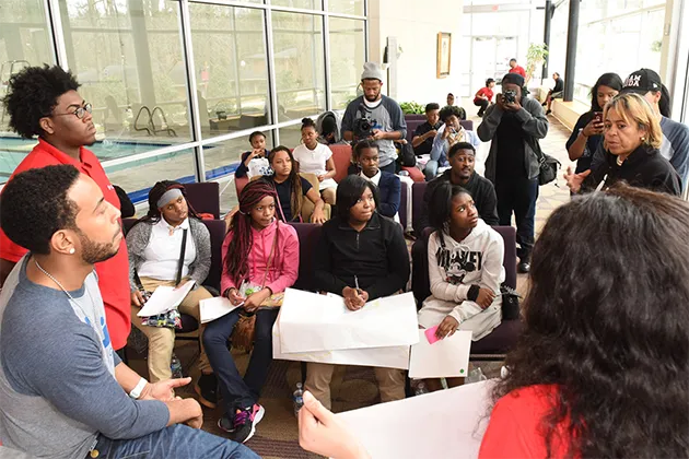 Chris 'Ludacris' Bridges speaking to a classroom full of students.